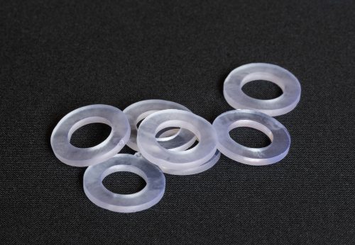 Plumbing silicone gaskets for repairing plumbing equipment of faucets on a dark gray background.